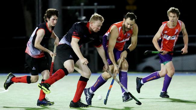 Cairns Hockey Association A-grade men's elimination semi-final between Souths and Stingers. Souths' Wesley Bevans and Stingers' Rohan Sparkes. PICTURE: STEWART McLEAN