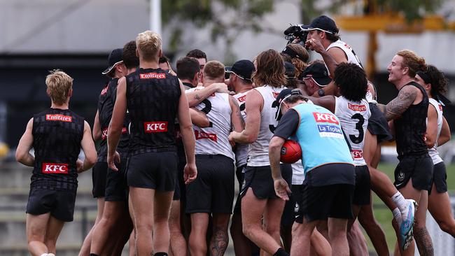 Collingwood players mob Oscar Steene after the announcement. Picture: Michael Klein