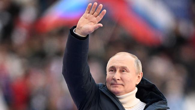 Vladimir Putin waves during a concert marking the eighth anniversary of Russia's annexation of Crimea at the Luzhniki stadium in Moscow last week. Picture: AFP