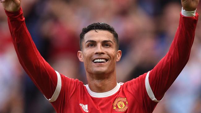 Manchester United's Portuguese striker Cristiano Ronaldo celebrates after scoring their second goal. Photo by Oli SCARFF / AFP.