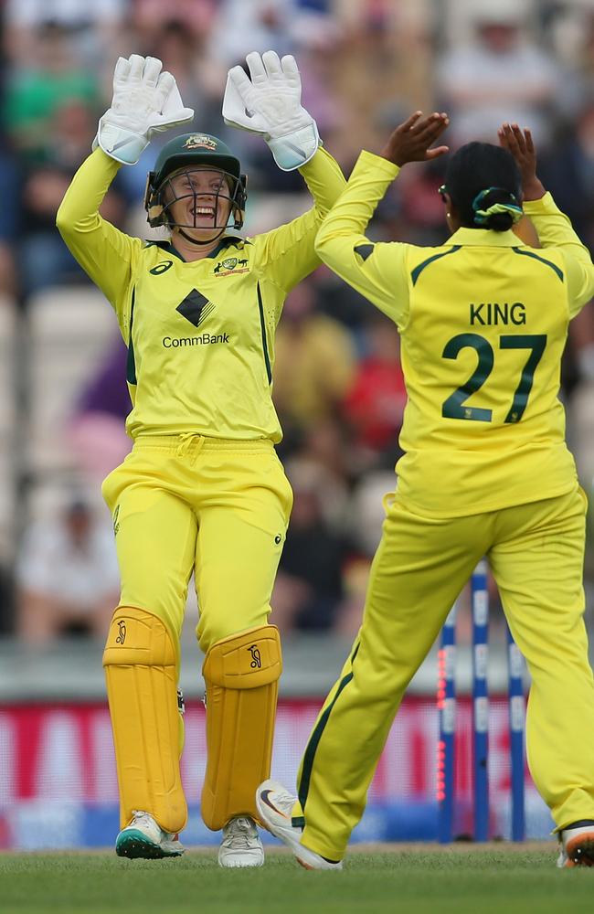 Alyssa Healy and Alana King of Australia celebrate after taking the wicket of Tammy Beaumont. (Photo by Steve Bardens/Getty Images)