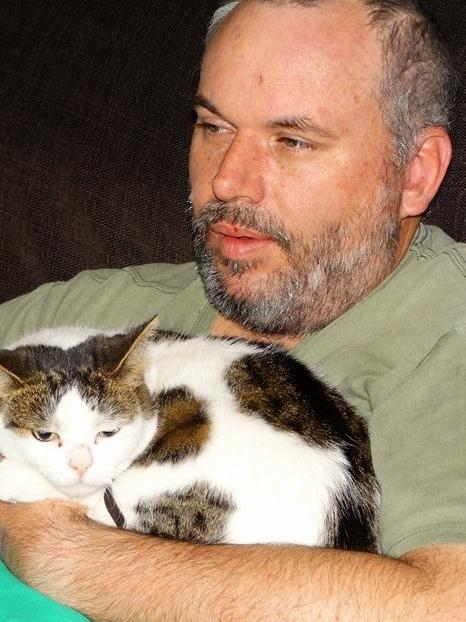 Tony Wittmann with one of his cats.