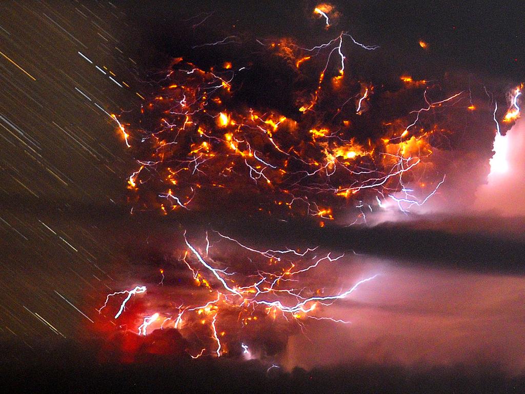 Volcanic lightning is seen flickering through the ash plume in this timelapse picture of the Puyehue volcano in 2011. Picture: AP