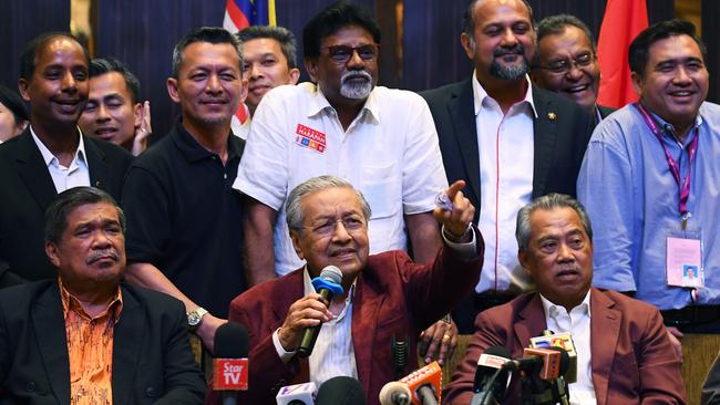 Former Malaysian prime minister and opposition candidate Mahathir Mohamad (C) answers a question during a press conference in Kuala Lumpur. Picture: AFP.