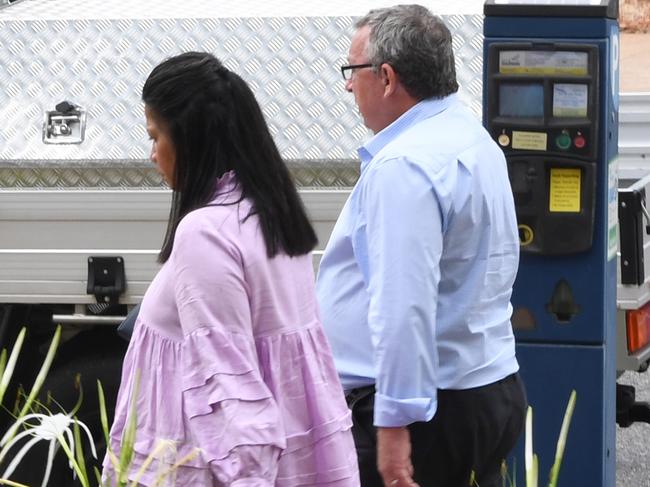 Former Jabiru fire station OIC Damien Parker leaves the Darwin Local Court with his wife, Karreen Noble, after pleading guilty to assaulting her and two other women.