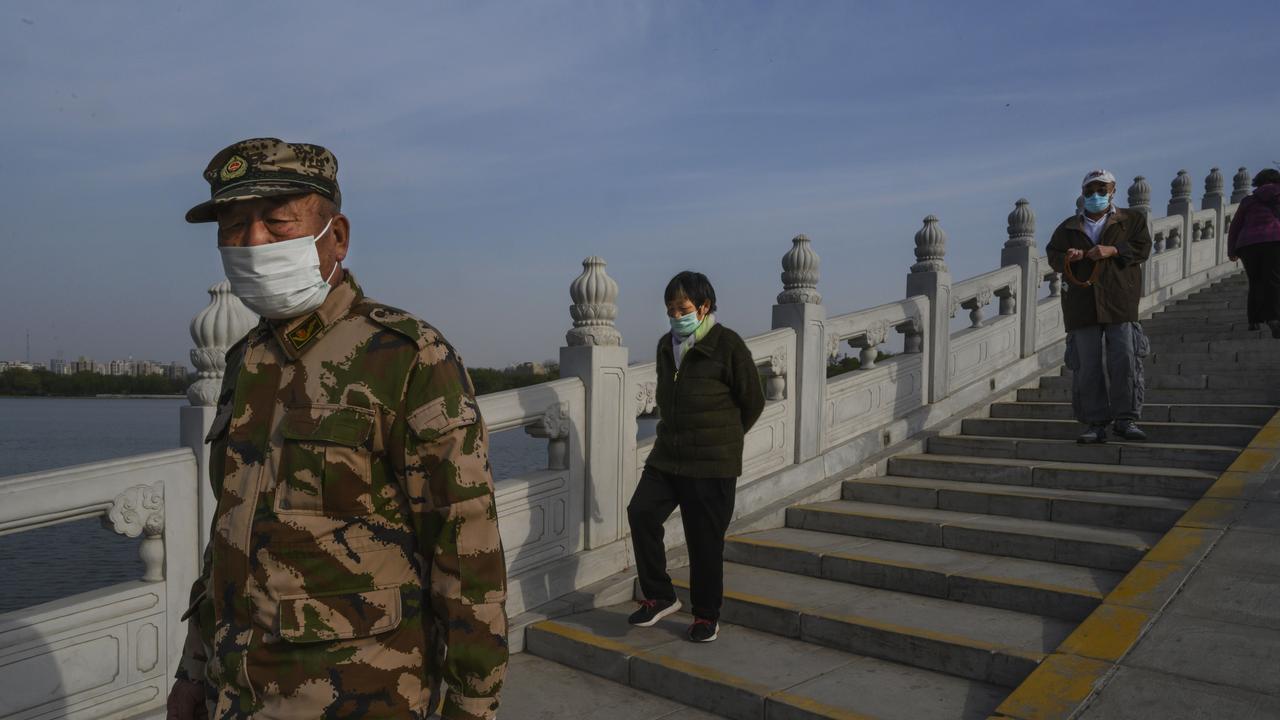 China’s military wear face masks. Picture: Kevin Frayer/Getty Images)