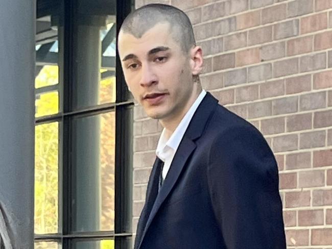 Christopher Carrig at Burwood Local Court on Tuesday in Sydney, flanked by his solicitor, Teagan McConchie. Carrig is accused of a raft of offences pertaining to allegedly tagging swastikas around Macquarie University's campus and intimidating a Jewish man. PIC: Alexi Demetriadi