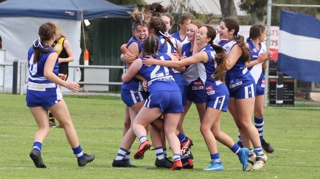 The Port Noarlunga U14 girls celebrate their dramatic grand final win which sealed their undefeated season. Picture: Victoria Corbett