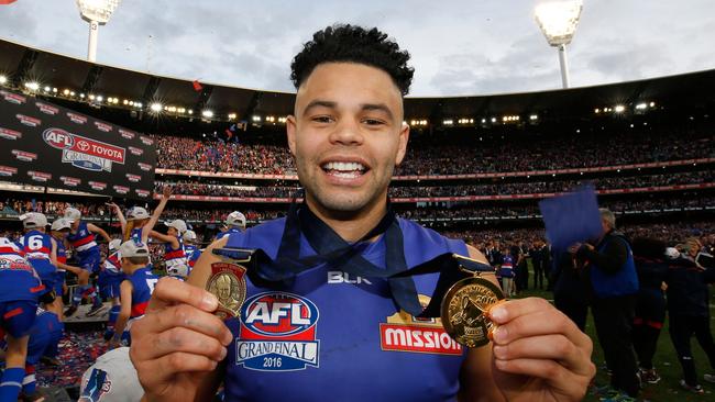 Jason Johannisen with the Norm Smith and Brownlow medals. Picture: Getty Images