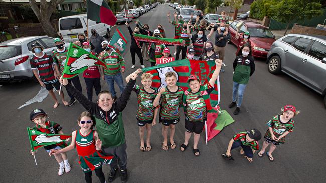 South Sydney fans in Mascot cheer for their team ahead of this weekend’s NRL grand final against Penrith. Picture: Adam Yip