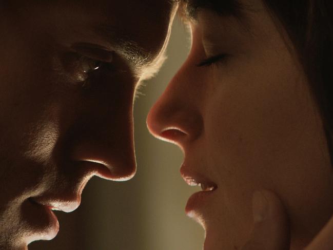 In this image released by Universal Pictures and Focus Features, Jamie Dornan, left, and Dakota Johnson appear in a scene from 