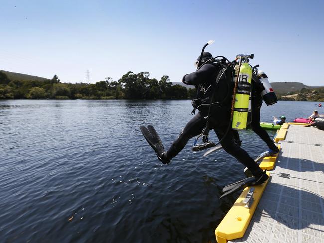 John Butterworth (pictured in the Derwent River at The Millbrook Rise Boat Ramp), brother of Lucille Butterworth, flew to Tasmania from Queensland to search for the remains of his sister. His friend and master diver, Phil Shepherd (left) assisted in the search. Picture: MATT THOMPSON