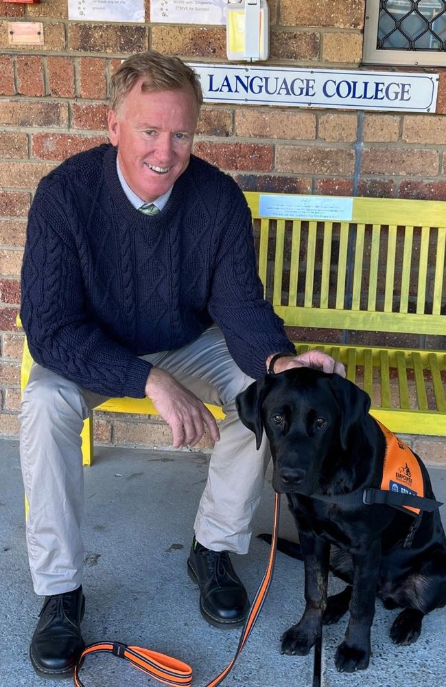 Kevin Lynch with Barney the therapy dog.
