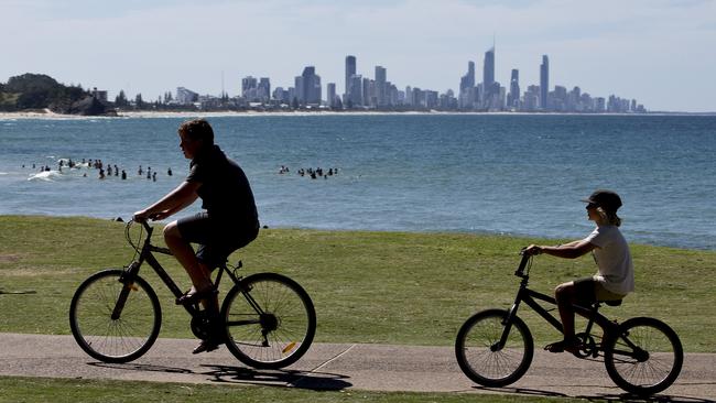 People enjoying the sun and sand at Burleigh Beach on Wednesday. Photo: Jerad Williams