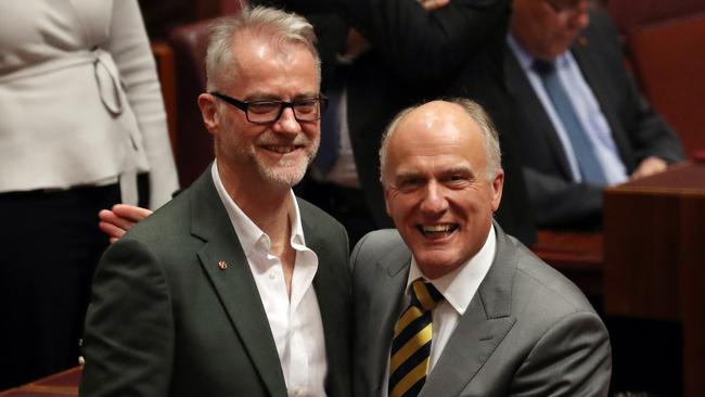 NSW Labor senator Tony Sheldon is congratulated by Eric Abetz after his first speech in the Senate chamber. Picture: Gary Ramage.