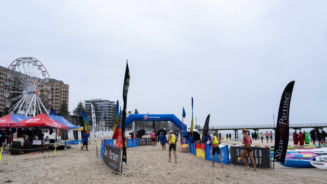 Wet weather at a competitive Surf Life Saving event at Glenelg Beach on Saturday. Picture: Morgan Sette