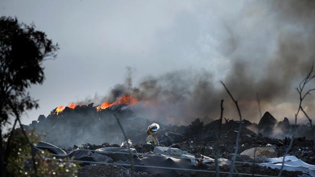 Fire crews are battling the toxic blaze. Picture: Andrew Henshaw