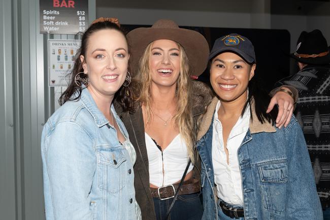 Sarah Nitz, Emma Flynn and Janice Drummond at the PBR Bull Pit Bull Bash at Dittmann Bucking Bulls in Bloomsbury. August 27, 2022. Picture: Michaela Harlow