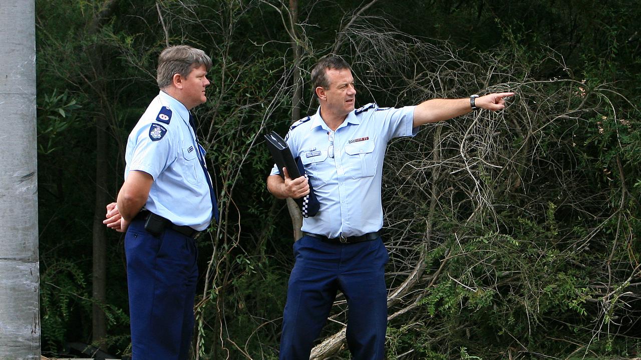 Assistant Commissioner Luke Cornelius (left) inspects a car crash scene in Crib Point with Senior Sergeant Clive Williams (right) in 2011.