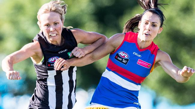 Melissa Kuys and Nicole Callinan clash in a AFLW warm-up. Picture: Stuart Walmsley