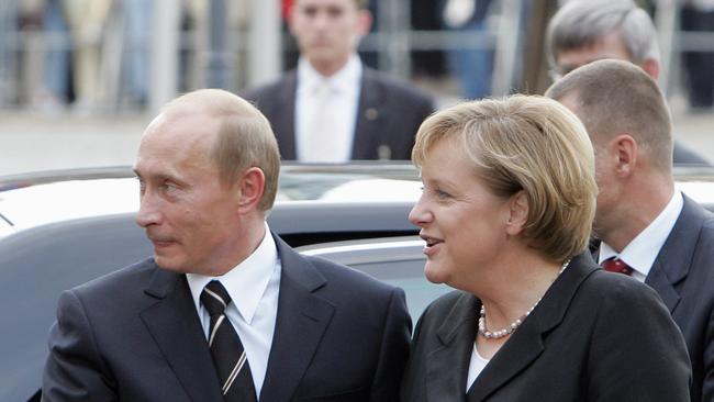 As German chancellor in 2006, Angela Merkel welcomes Russian President Vladimir Putin to the eastern German city of Dresden to discuss energy security. Behind a green facade, Germany hid a lifeline to Russian fossil fuel. Picture: AFP/Denis Sinyakov