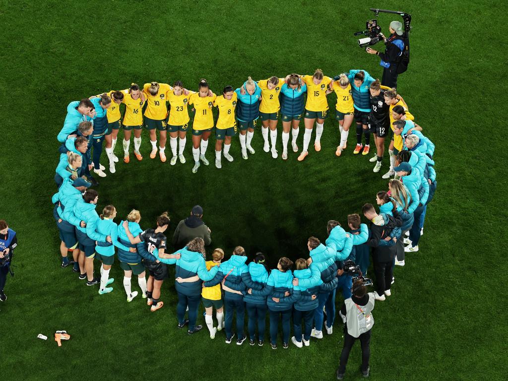 Australia players huddle after the 1-3 defeat. Picture: Robert Cianflone/Getty Images