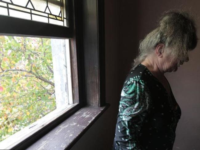 A woman in the hallway of the Gatwick Hotel in St Kilda where residents think it is a great place to live.