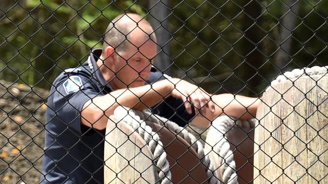 A police officer takes a look at a raft that is used by the Thunder River Rapid ride. Picture: NIGEL HALLETT