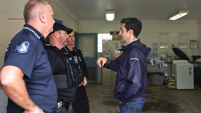 Queensland Premier David Crisafulli speaks with police officers from Brisbane who travelled to Cardwell to help with the flood disaster at the Cardwell police station. Picture: Brendan Radke