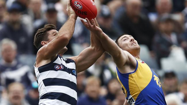 Tom Hawkins outmarks Jeremy McGovern.