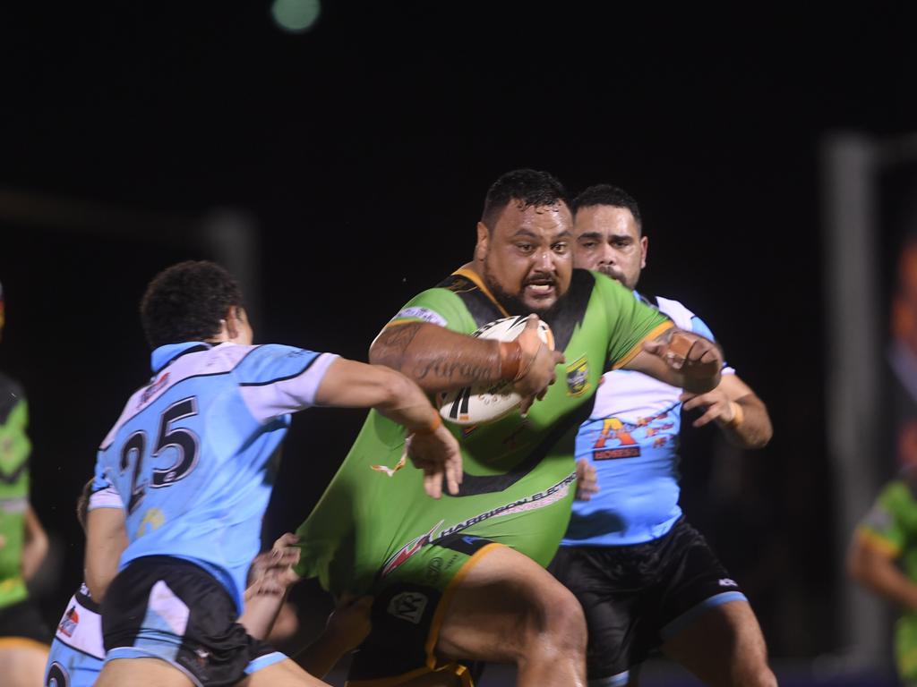 Palmerston Raiders Joel Turaga breaks through the Northern Sharks line in the NRLNT Grand Final 2022. Picture: (A)manda Parkinson