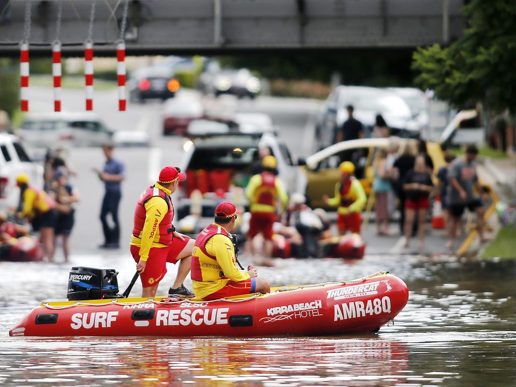 Surf lifesavers in the streets of Toowong last February