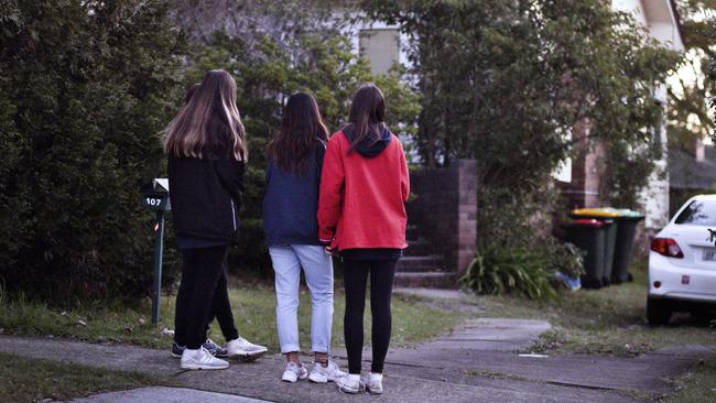 People gather outside the house in Sydney’s West Pennant Hills where John Edwards murdered his teenage children. Picture: Flavio Brancaleone