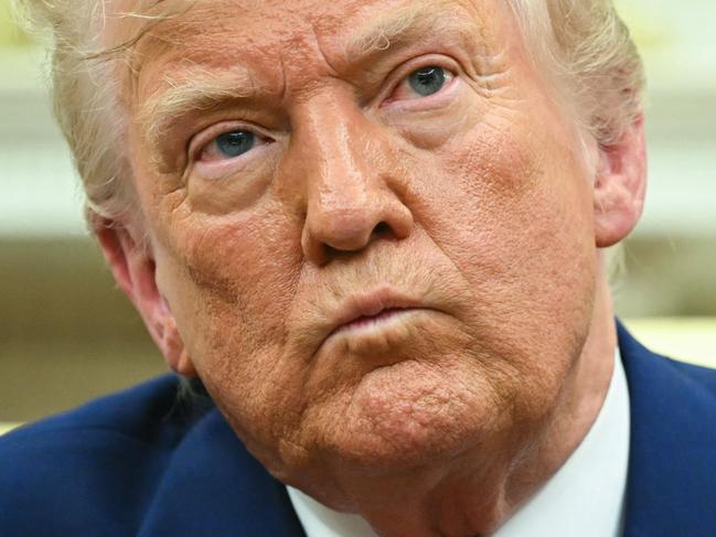 TOPSHOT - US President Donald Trump looks on during a meeting with Israeli Prime Minister Benjamin Netanyahu in the Oval Office of the White House in Washington, DC, on April 7, 2025. Israeli Prime Minister Benjamin Netanyahu was in Washington on Monday to meet Donald Trump, whom he will likely ask for a reprieve from US tariffs while seeking further backing on Iran and Gaza. (Photo by SAUL LOEB / AFP)
