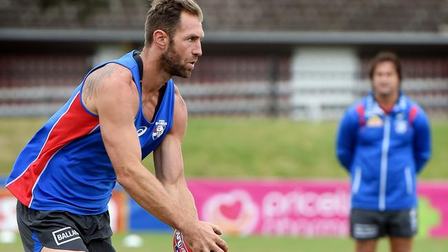 Travis Cloke trains with Luke Beveridge in the background. Picture: Nicole Garmston