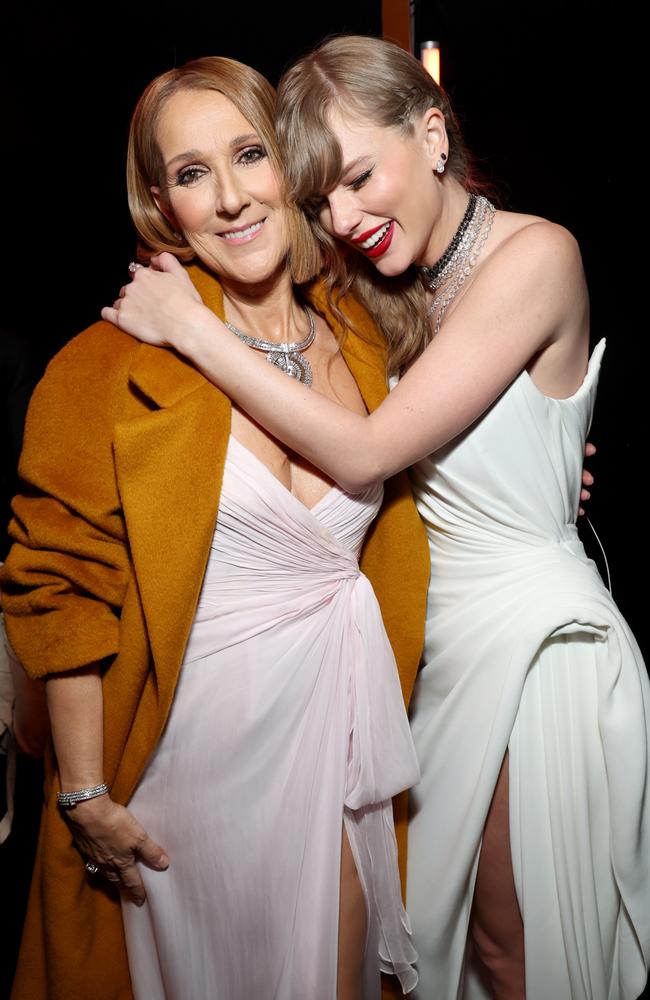 Celine and Taylor share a hug backstage. Picture: Kevin Mazur/Getty
