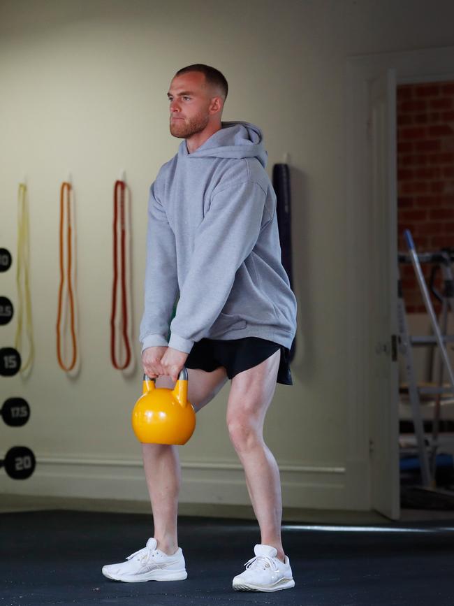 Tom Mitchell of the Hawks trains in isolation at his home. Picture: Getty Images