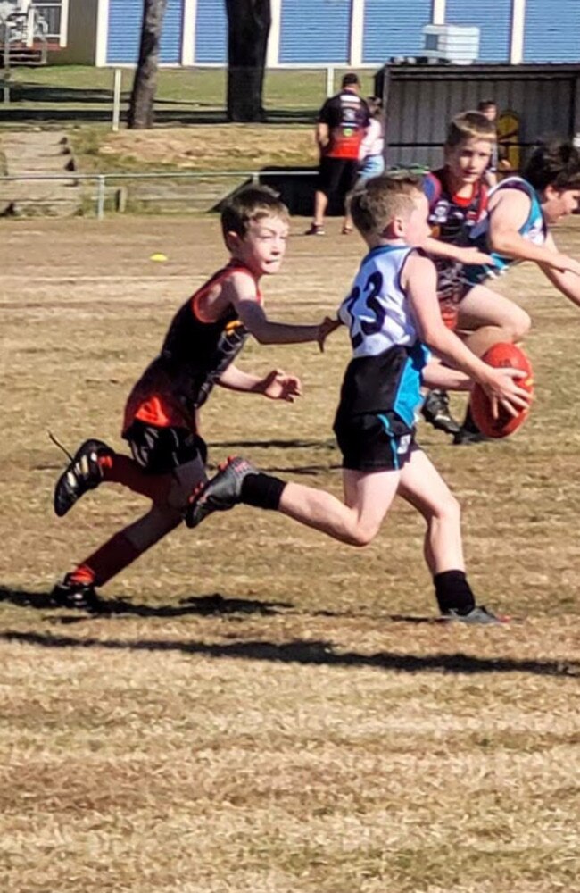 Collingwood Park AFL junior Riley Brand in action.