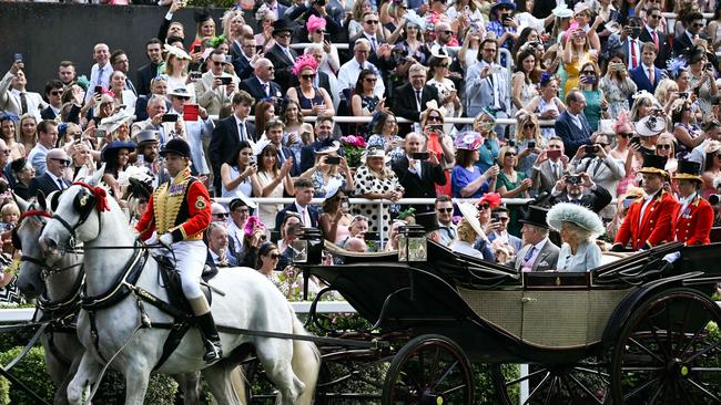 Ascot racegoers gave the King and Queen a rapturous reception. Picture: AFP