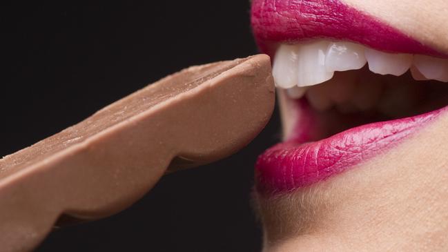 Young Woman Eating Chocolate