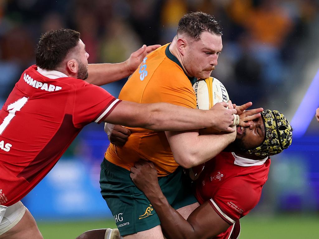 Matt Faessler is tackled by Wales. Picture: Cameron Spencer/Getty Images