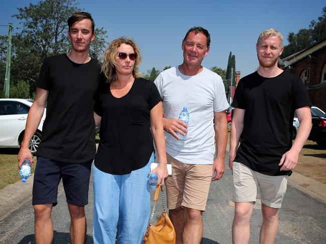 The Cochrane family, son Tate, Mum Leanne. Dad Gary and Son Sam put on a brave face after losing everything  in  yesterday's devastating fires at Tathra on the NSW South Coast. Pictrures: Ray Strange.