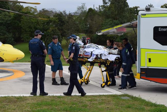 The 12-year-old Monkland girl who suffered serious burns and smoke inhalation in a house fire is transferred to a Careflight helicopter to be flown to Lady Cilento Children's Hospital. Picture: Francesca Mcmackin