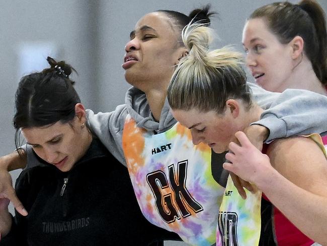 Shamera Stirling of the Thunderbirds is helped off court after going down on her ankle during Thunderbirds training at Netball SA stadium before this weekends Grand Final Tuesday July,4,2023.Picture Mark Brake
