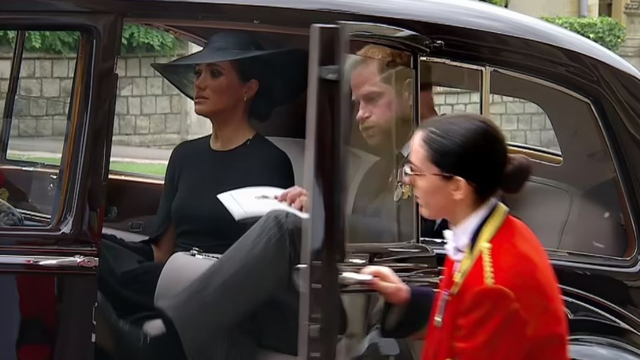 Meghan Markle and Prince Harry leave St. George's Chapel at Windsor castle after the Committal Service for Queen Elizabeth II.