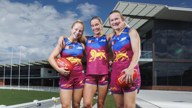 Brisbane Lions AFLW players Bella Dawes, Natalie Grider, and Shannon Campbell at their new Springfield training base.