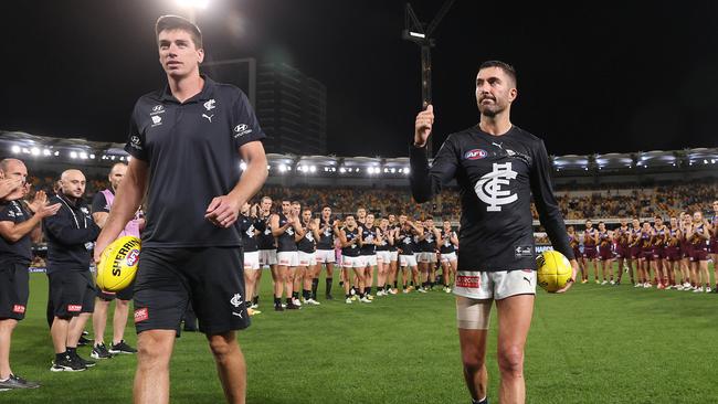 Carlton favourites Matthew Kreuzer and Kade Simpson leave the field for the last time. Picture: Michael Klein