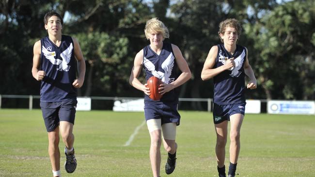 Tom Lamb (middle) with Edithvale-Aspendale juniors teammates  Daniel Capiron and Jack Holden after they made the Victorian schoolboys team in 2011.