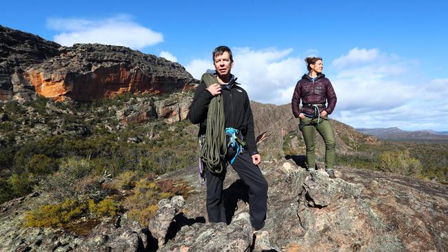 Rock climbing enthusiasts Simon Carter and Kerrin Gale on their way up to the 'Taipan Wall' in the Grampians. Picture: Aaron Francis/The Australian