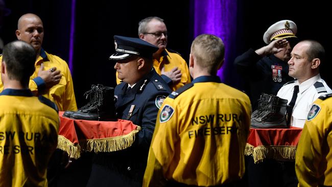 Fire boots representing the RFS and Coulson Aviation firefighters killed in the bushfires. Picture: Bianca De Marchi/AAP